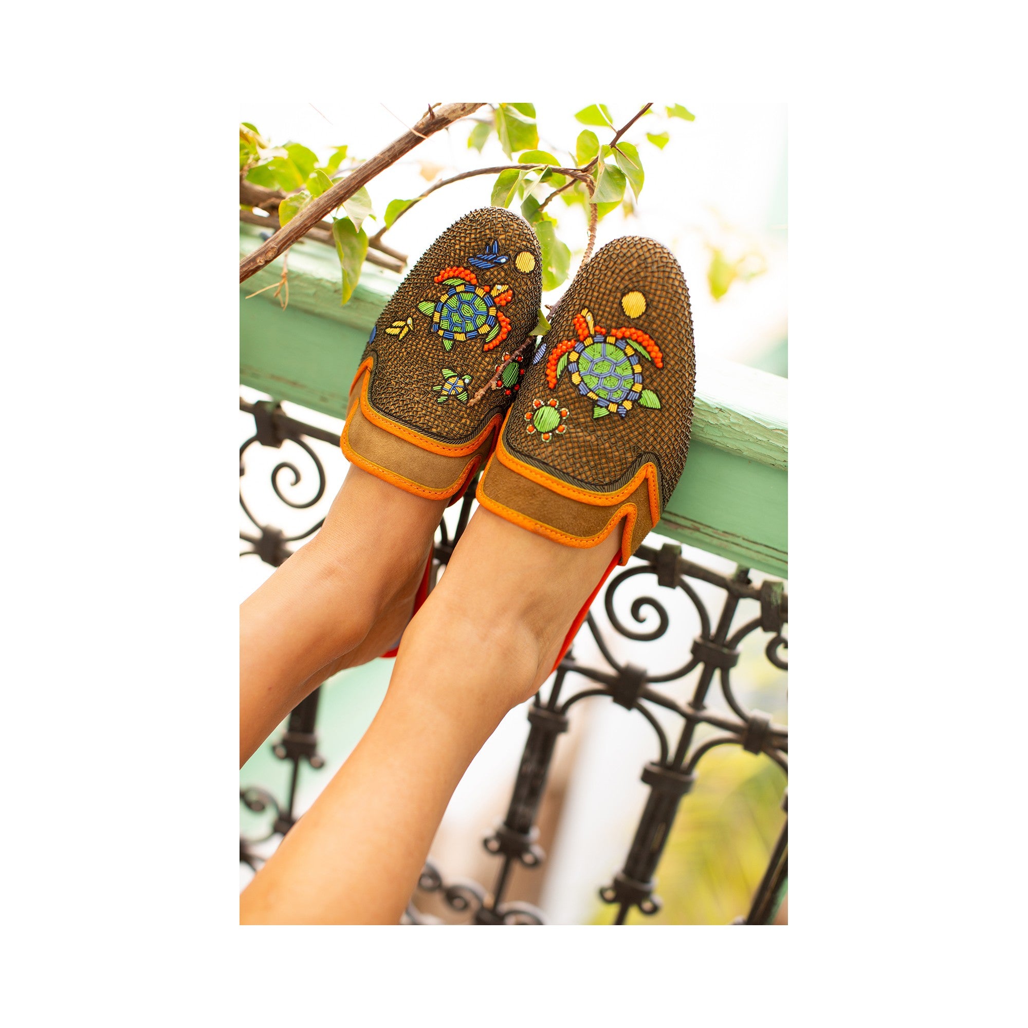 Meher Kakalia’s Darwin Slippers in suede spice-hina. Handmade eco leather slippers with turtle embroidery. Resort style luxury.