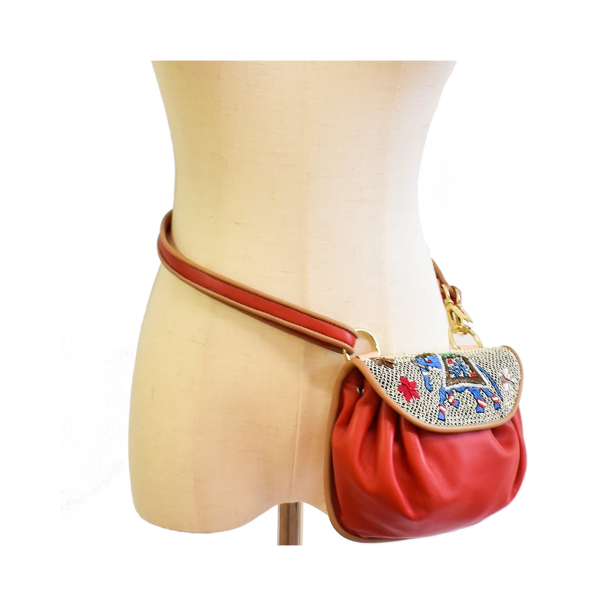 Red leather accordion bag with traditional coil embroidery and elephant motif.
