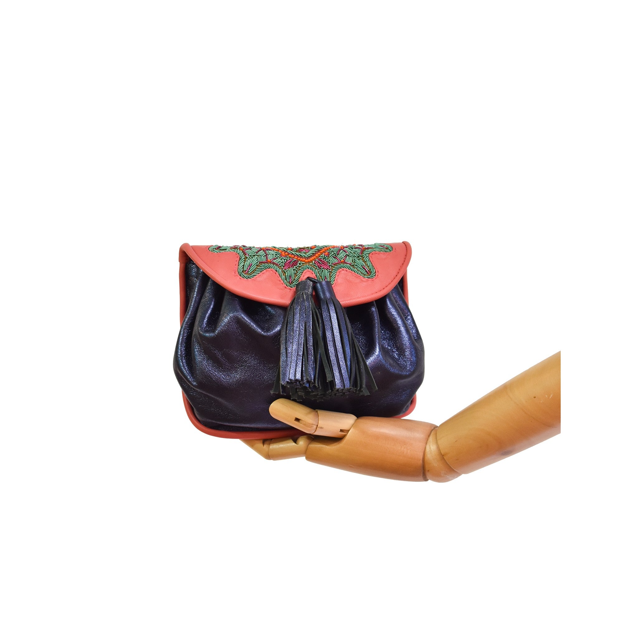 Women’s leather waist bag with hand embroidery and gold hardware.