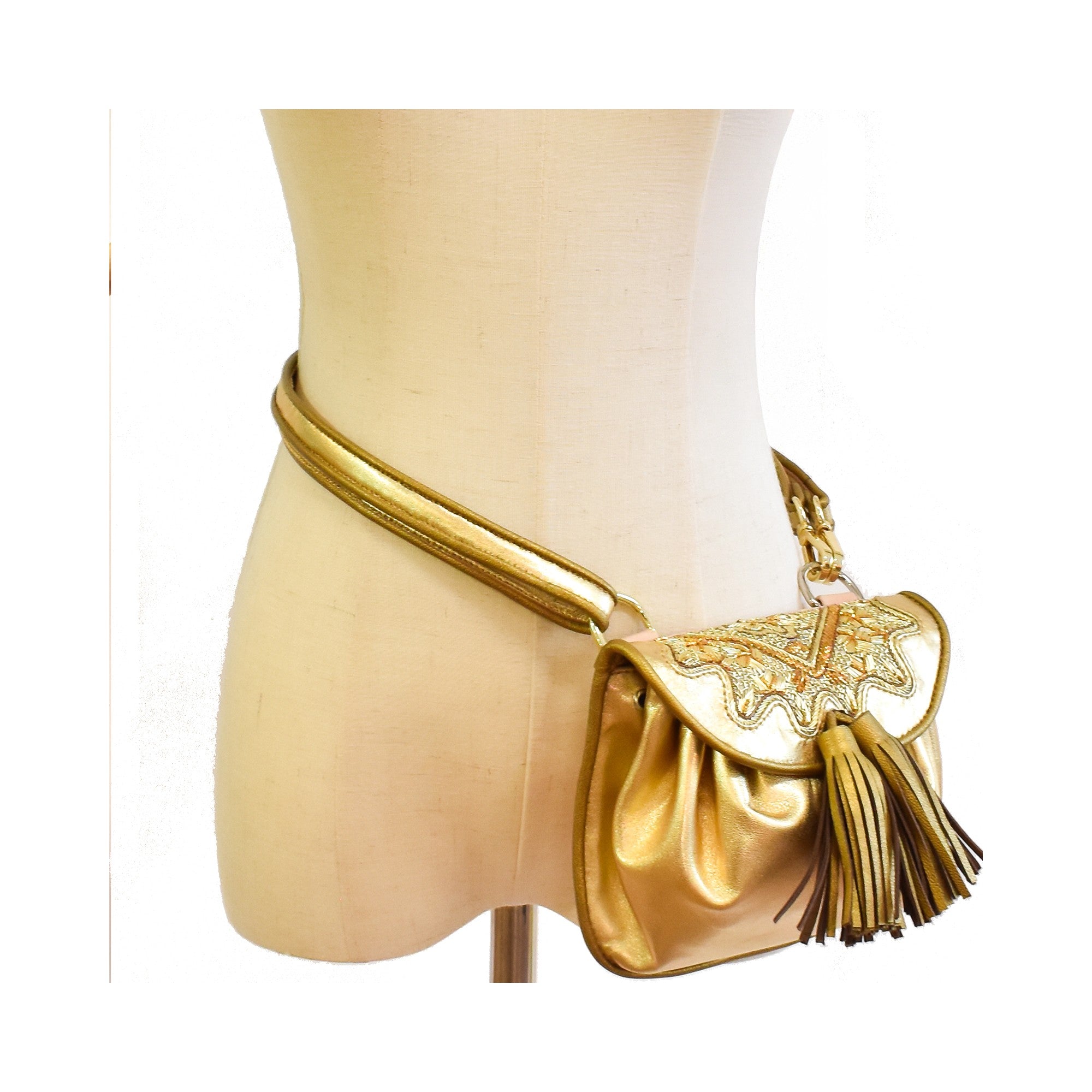 Metallic gold mini belt bag with embroidered flap and leather tassels.