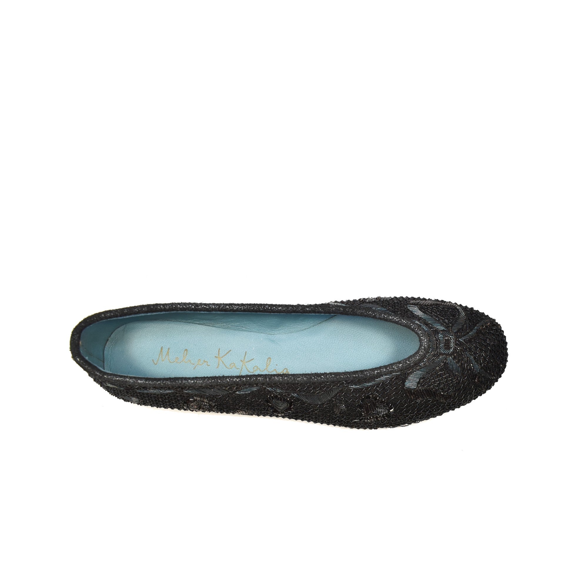 Top view of black metallic coil-embroidered flats, a perfect combination of elegance and luxury craftsmanship.