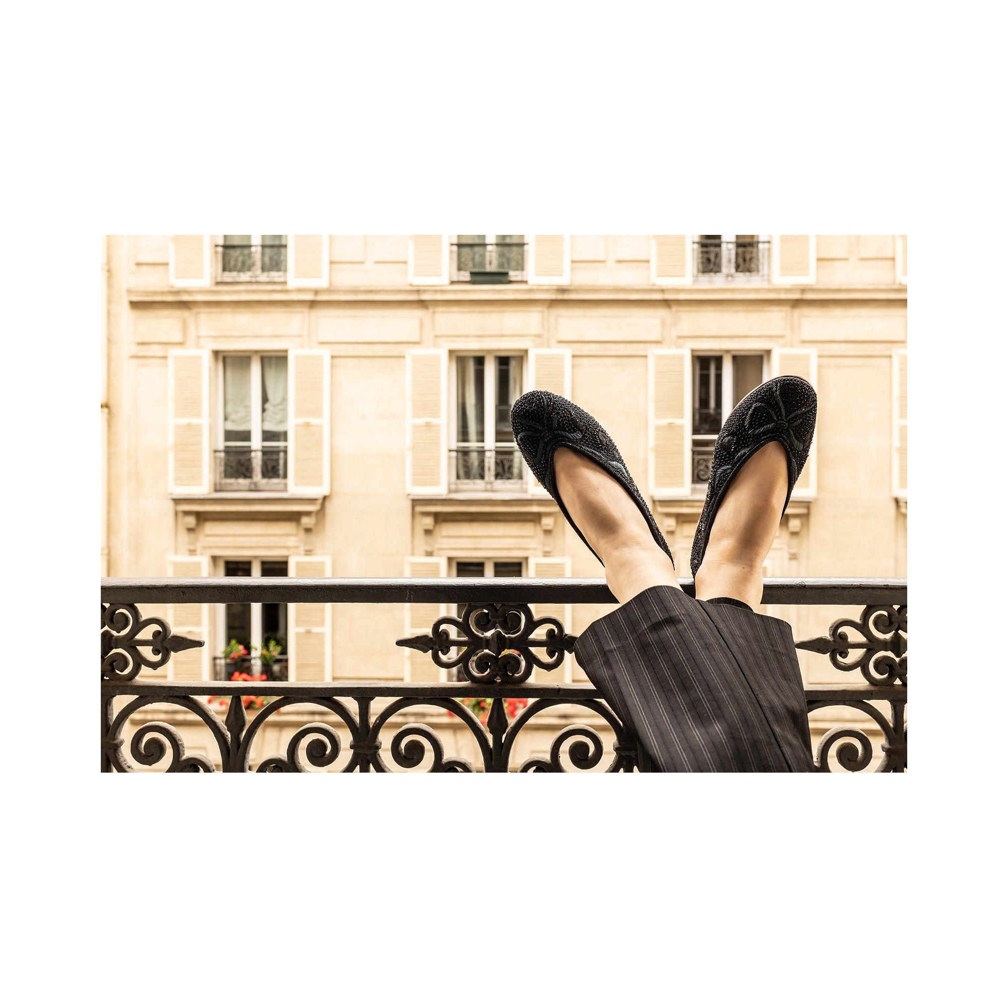 Luxurious black embroidered flats, perfect for black-tie events, showcasing intricate metallic embroidery.