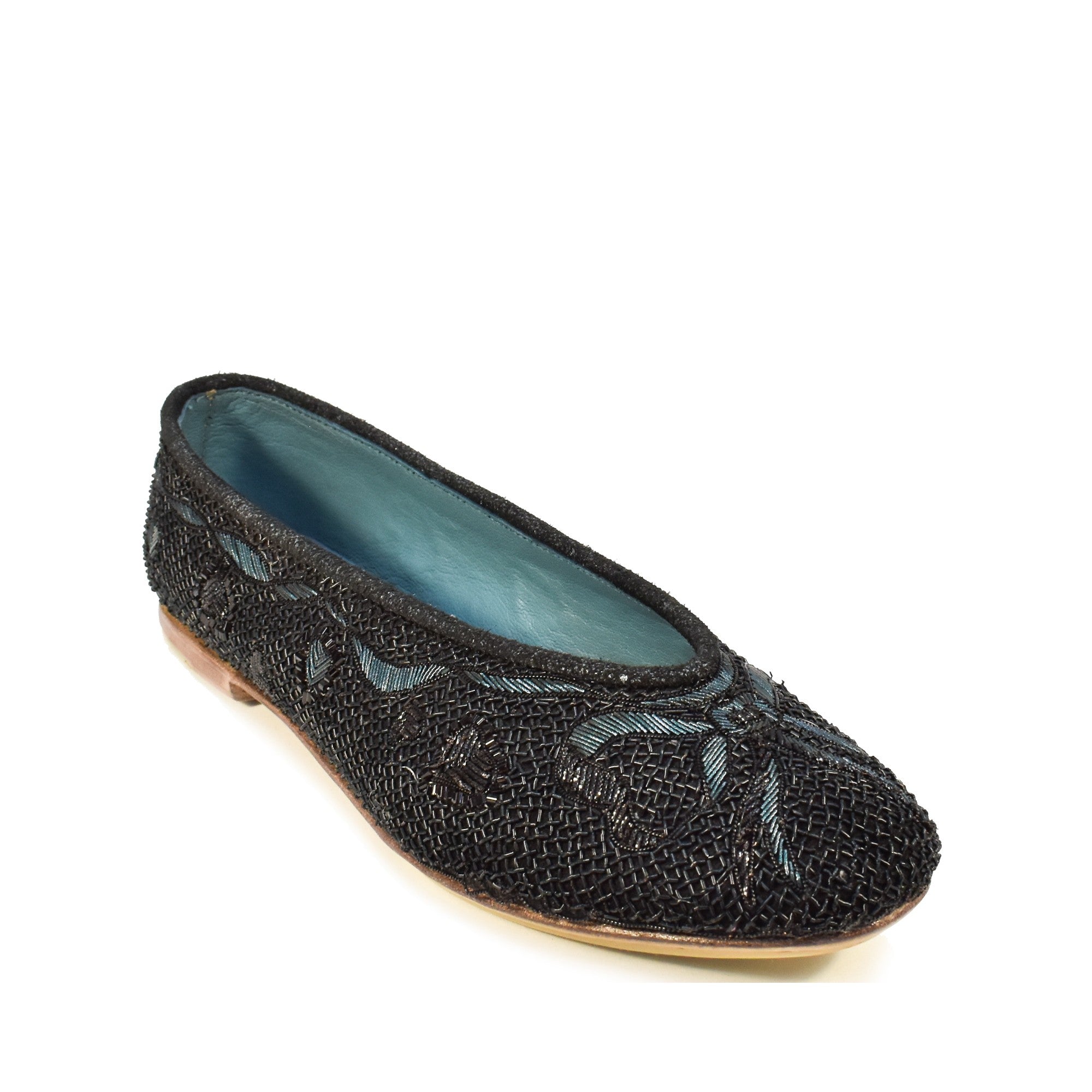 Luxury black flats with fine embroidery on velvet, designed for a delicate, feminine touch.