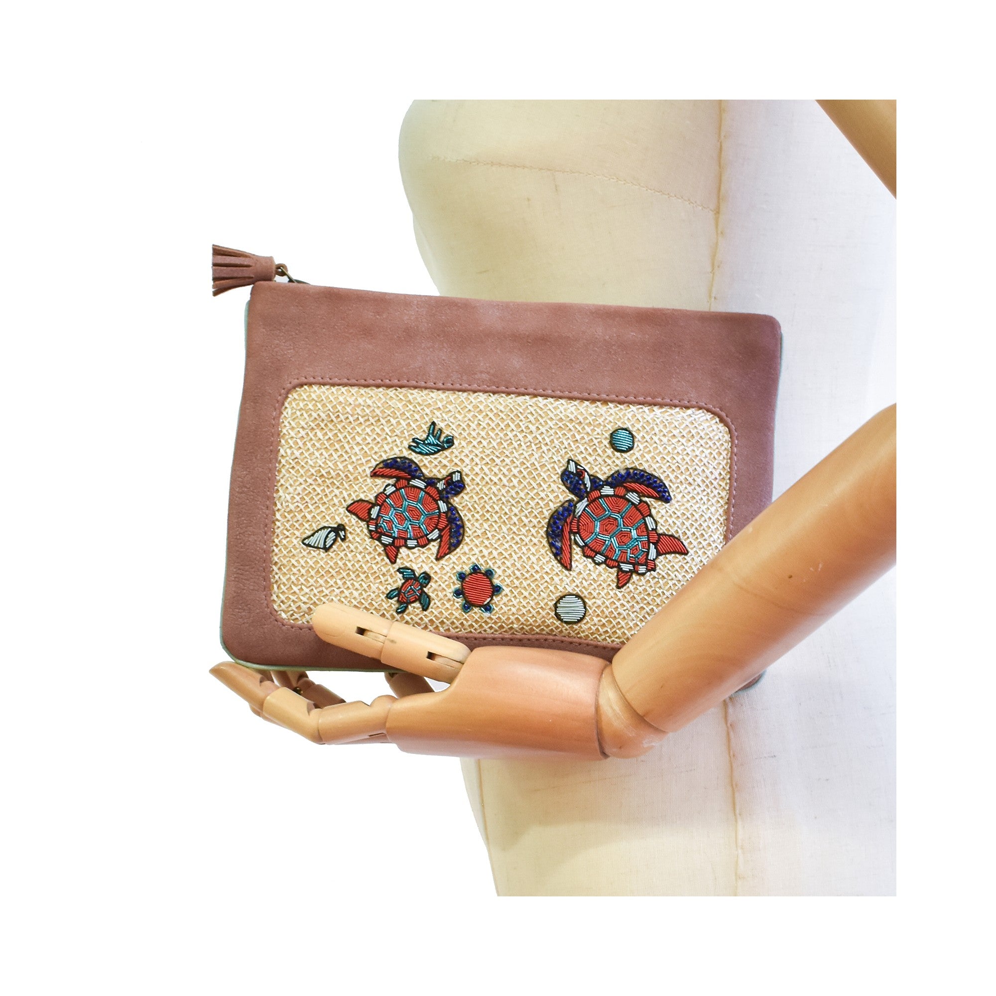 Front view of copper peach Darwin Pochette with hand embroidery