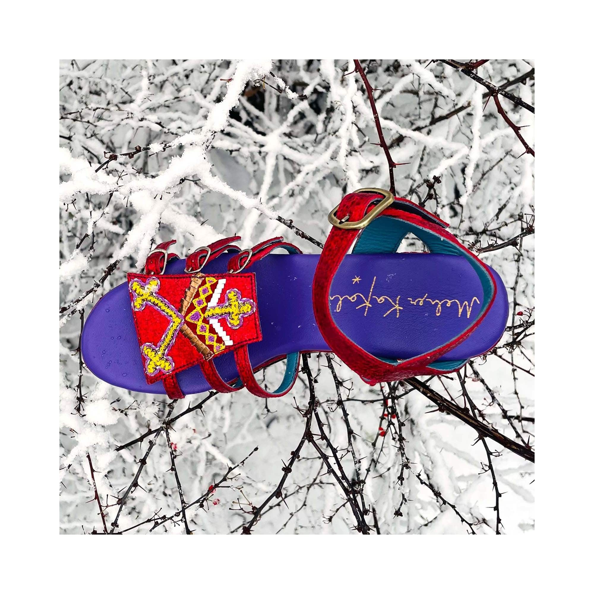 GOLD HOPPER splash poppy – top view with purple footbed and tribal embroidery photographed in snow