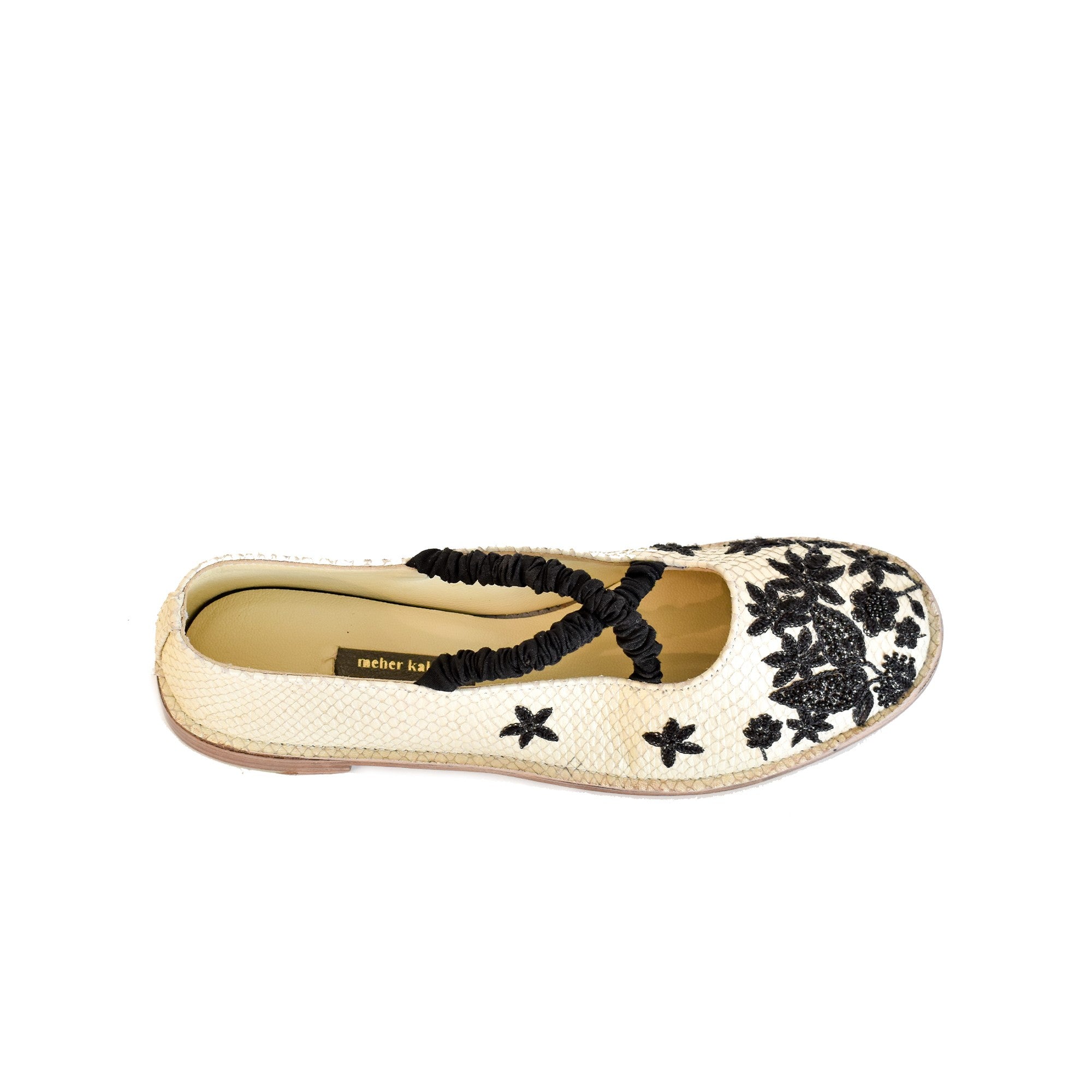 Embroidered Julietta flats by Meher Kakalia in shiny leather with elasticated silk cross, inspired by Dali & Picasso's style.