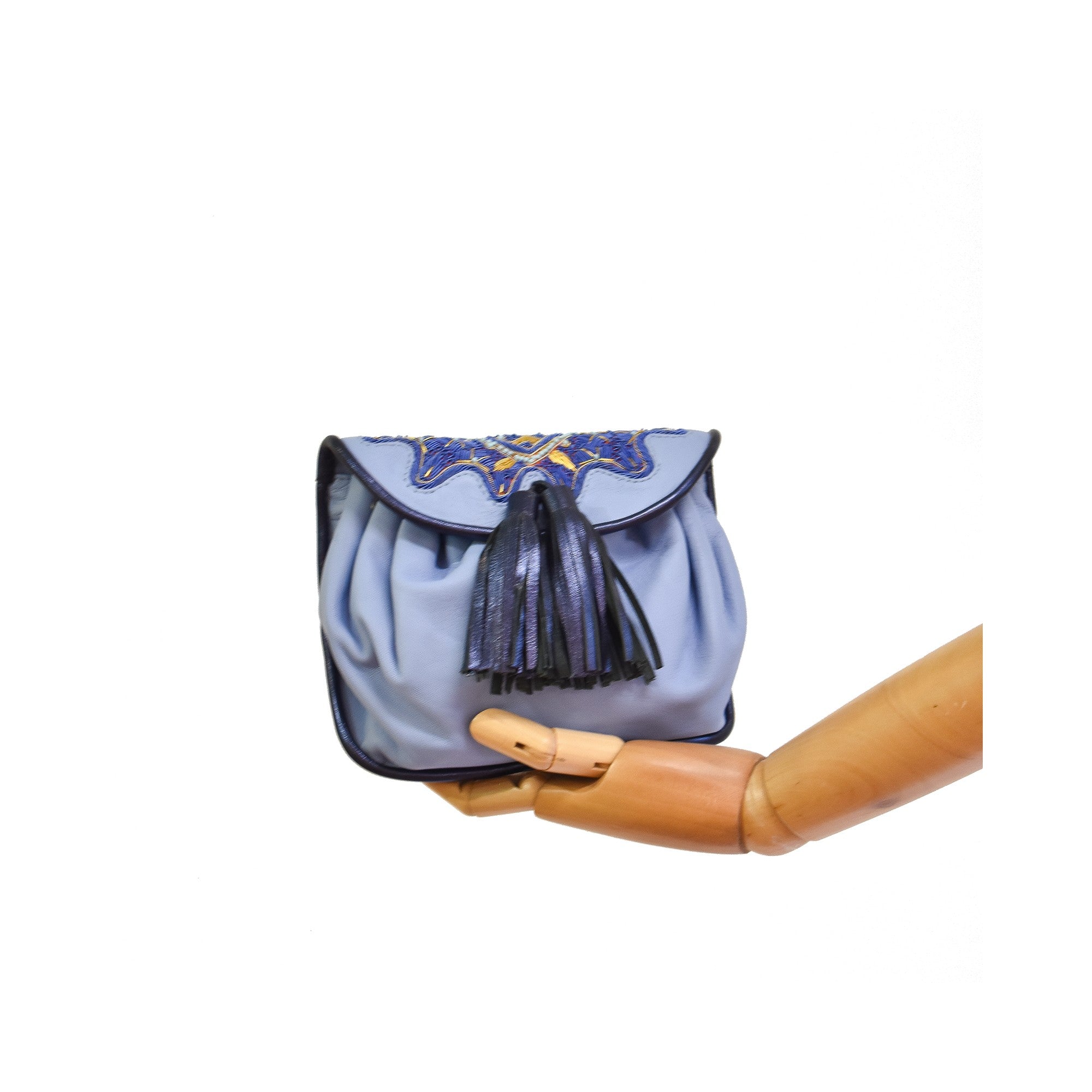 Women’s embroidered leather waist bag in soft blue.