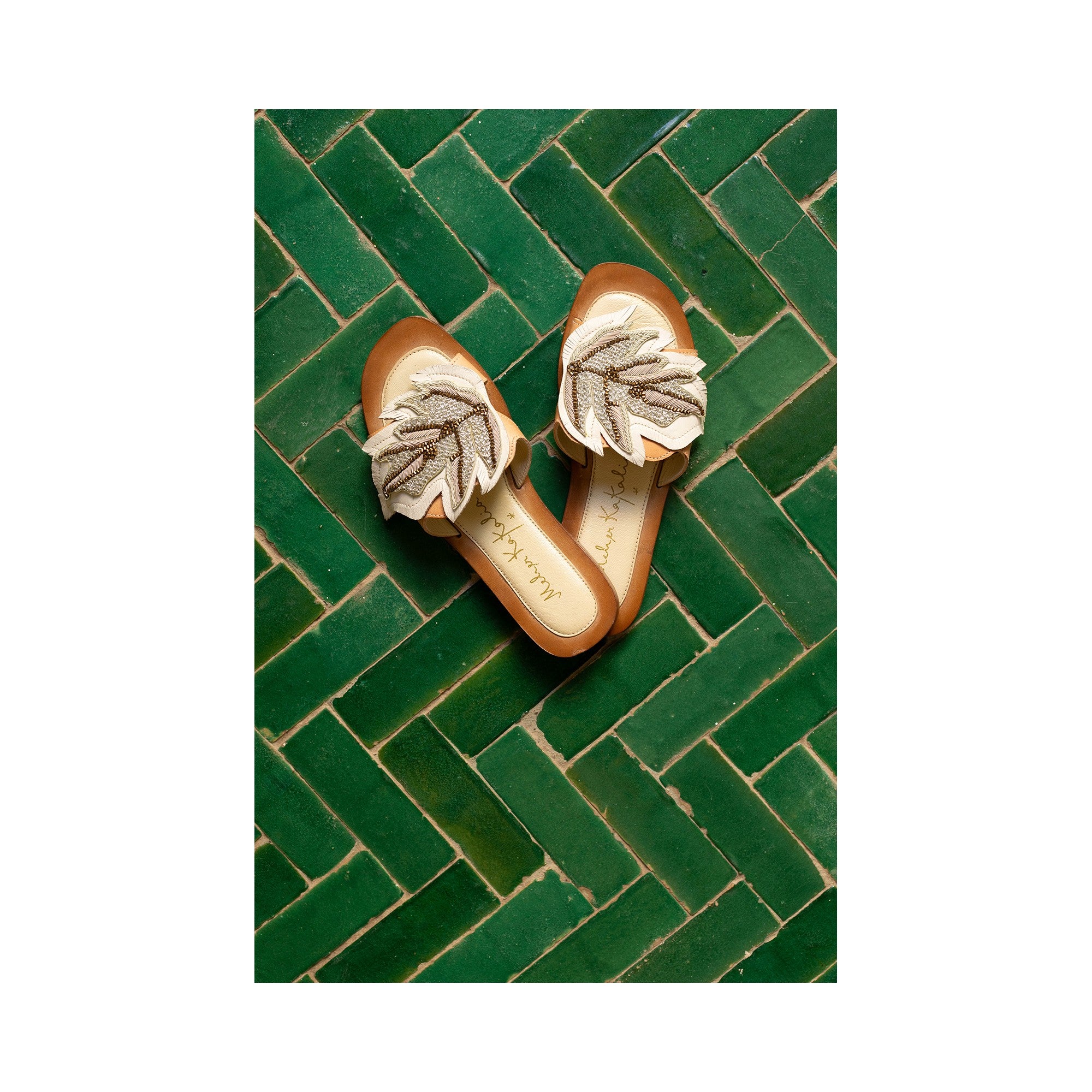 Hand embroidered white resort slides with palm leaf designs. Ideal for beach days, Miami, and tropical destinations.