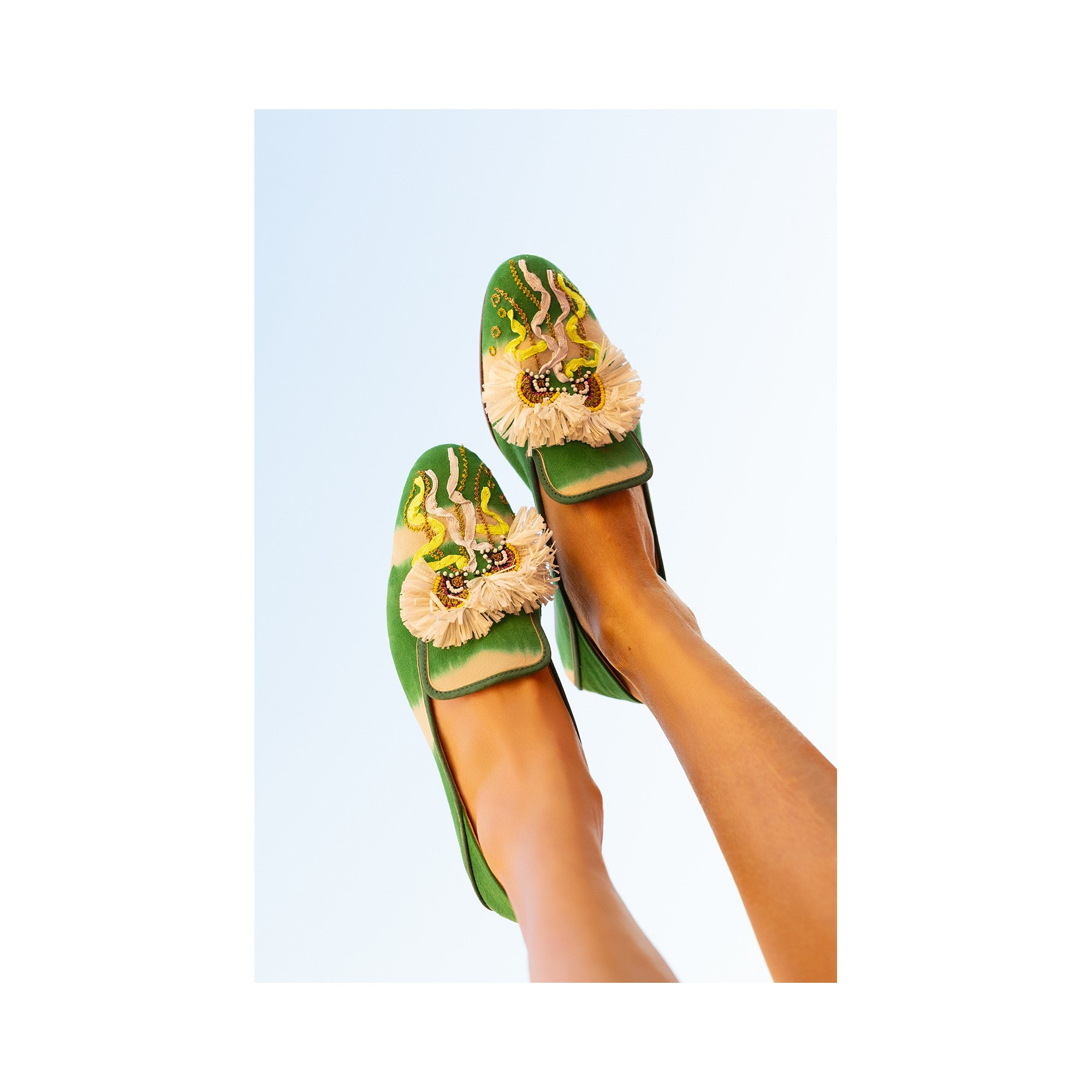 Hand-embroidered leather RIO moccasins in Kelly Green with Raffia and bead details, perfect for summer.